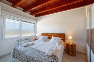 A bed or beds in a room at La Palomba Nature