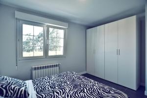Posteľ alebo postele v izbe v ubytovaní Apartamento Las Perdices II