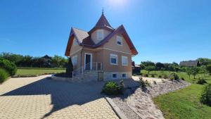 a large house with a tower on top of it at Holiday home in Siofok - Balaton 19917 in Siófok