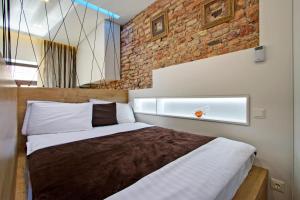 Cama ou camas em um quarto em Angel Wing Apartamentai