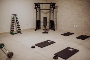 a gym with several mats on the floor in a room at MANANCIAL HOTEL E EVENTOS in Manhuaçu
