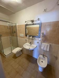 Koupelna v ubytování Hotel Olimpia