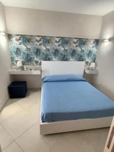 Postel nebo postele na pokoji v ubytování Residence PEGA B&B