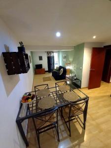 Posezení v ubytování Cornukarma Apartamiento La Capella + 7 fotografií
