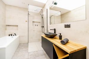 a bathroom with a sink and a shower at Villa Warminska in Kręsk +44 photos