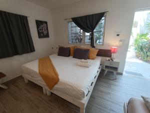 Postel nebo postele na pokoji v ubytování Kika Studios