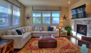 a living room with a couch and a fireplace at Our Beach Adventure in Ocean Shores