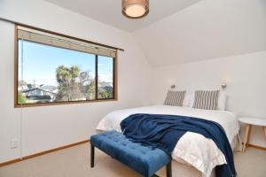 Ένα ή περισσότερα κρεβάτια σε δωμάτιο στο Bristol St - Christchurch Holiday Homes