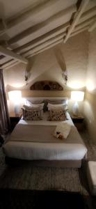Postel nebo postele na pokoji v ubytování Candelaria House Boutique