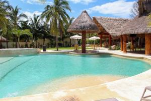 a swimming pool in front of a resort at Villa Marcela in Calderitas
