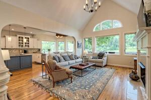 a living room with a couch and a table at Chic Sky Valley Resort Home on Golf Course! in Sky Valley