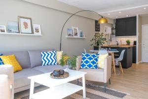 a living room with a couch and a table at Panoramic App C03-4 Sonnendeck in Sierksdorf