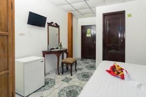 Televízia a/alebo spoločenská miestnosť v ubytovaní Grand Hotel Leon Marino Galapagos
