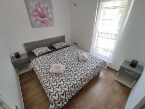 Ein Bett oder Betten in einem Zimmer der Unterkunft Apartman Ivana