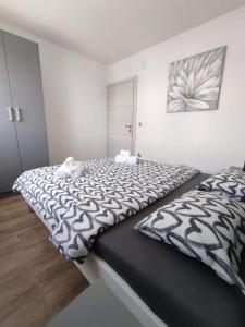 Postel nebo postele na pokoji v ubytování Apartman Ivana