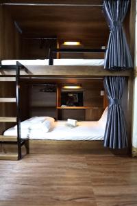 a bedroom with two bunk beds in a room at Bui Vien Street Hostel in Ho Chi Minh City