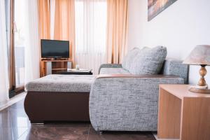 A television and/or entertainment centre at Bivalvia Apartments