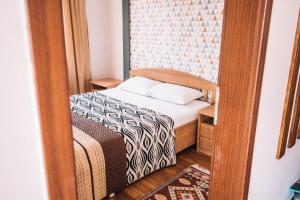 A bed or beds in a room at Bivalvia Apartments