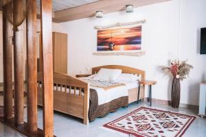 A bed or beds in a room at Bivalvia Apartments