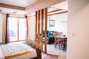 A bed or beds in a room at Bivalvia Apartments Még 37 kép