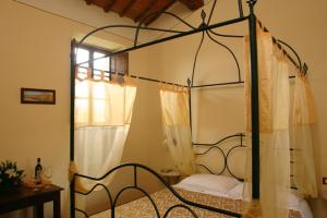 Posteľ alebo postele v izbe v ubytovaní Agriturismo Il Sasso