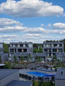a view from the roof of a building with two pools at MANO JŪRA 2 SILVER in Palanga