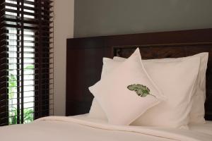 Postel nebo postele na pokoji v ubytování Cochin Sang Hotel