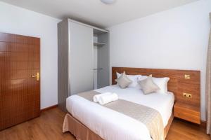 Postel nebo postele na pokoji v ubytování CySuites Apartment Hotel