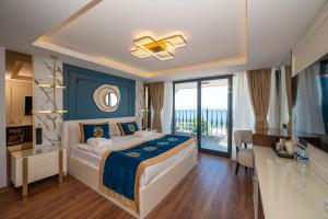 Postel nebo postele na pokoji v ubytování The Byzantium Suites Hotel & Spa