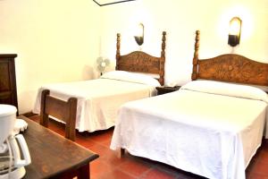 Letto o letti in una camera di Posada del Cafeto