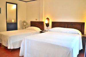 Letto o letti in una camera di Posada del Cafeto