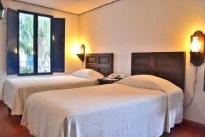 Letto o letti in una camera di Posada del Cafeto
