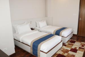 Letto o letti in una camera di Hotel Mega & Apartment