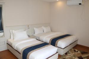 Letto o letti in una camera di Hotel Mega & Apartment