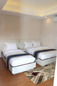 Letto o letti in una camera di Hotel Mega & Apartment