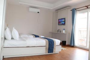 Letto o letti in una camera di Hotel Mega & Apartment