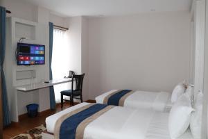 Letto o letti in una camera di Hotel Mega & Apartment