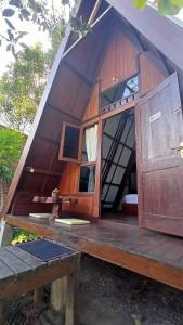 an outside view of a dome house with a bench at Bliss family cottage Batu in Batu