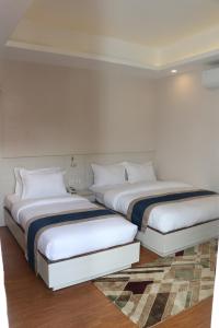 Letto o letti in una camera di Hotel Mega & Apartment