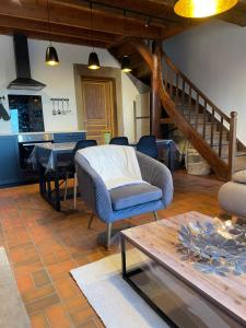 a living room with a couch and a table at Les Gîtes de l'aiguete in Hauterives