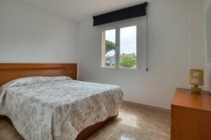 Posteľ alebo postele v izbe v ubytovaní Apartament a Sant Antoni de Calonge