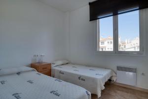 Posteľ alebo postele v izbe v ubytovaní Apartament a Sant Antoni de Calonge
