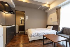 Ένα ή περισσότερα κρεβάτια σε δωμάτιο στο Piece Chitose S1