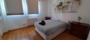 a small bedroom with a bed and a window at Casa Melitona in Castiello de Jaca +13 photos