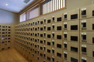 a large room with a wall of boxes at Onyado Nono Matsumoto Natural Hot Spring in Matsumoto