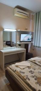 A bed or beds in a room at Aheloy Apartments