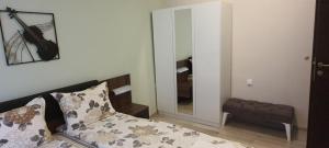 A bed or beds in a room at Aheloy Apartments