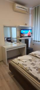 A television and/or entertainment centre at Aheloy Apartments