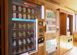 a vending machine filled with lots of drinks at Onyado Nono Matsumoto Natural Hot Spring in Matsumoto