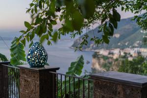 a vase sitting on top of a balcony with a view at Villa Denise in Vico Equense